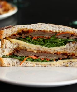 Close-up of a hearty sandwich with fresh ingredients, ready to enjoy.